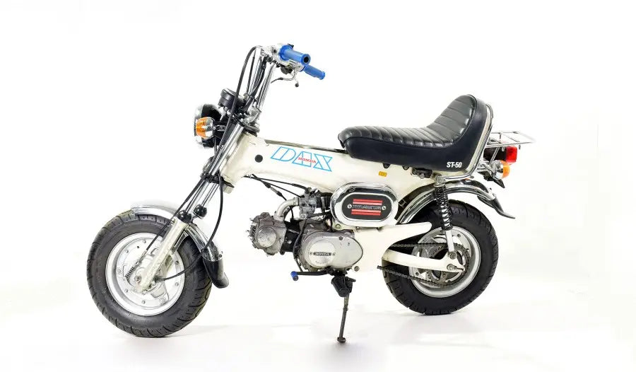 Honda DAX ST 70 motorcycle on a white background