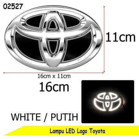 Toyota LED logo light emblem with dimension markings showing 16cm x 11cm, a white illuminated view inset, and text reading 'WHITE' and 'Lamp LED Logo Toyota'.