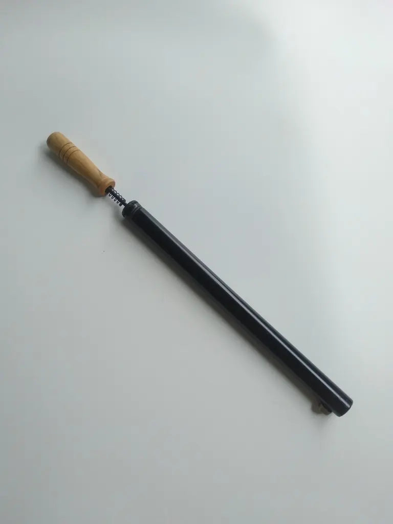 Classic bicycle frame pump featuring wooden handle and English valve