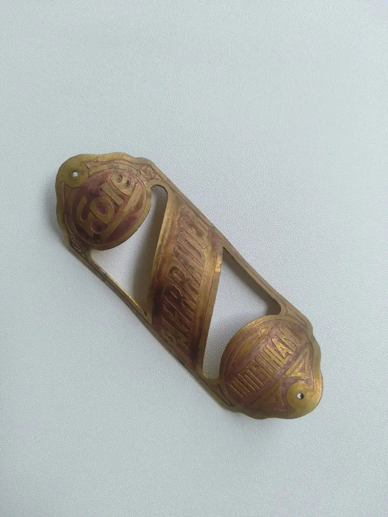 Handmade Pahrrader brass bicycle head badge left view