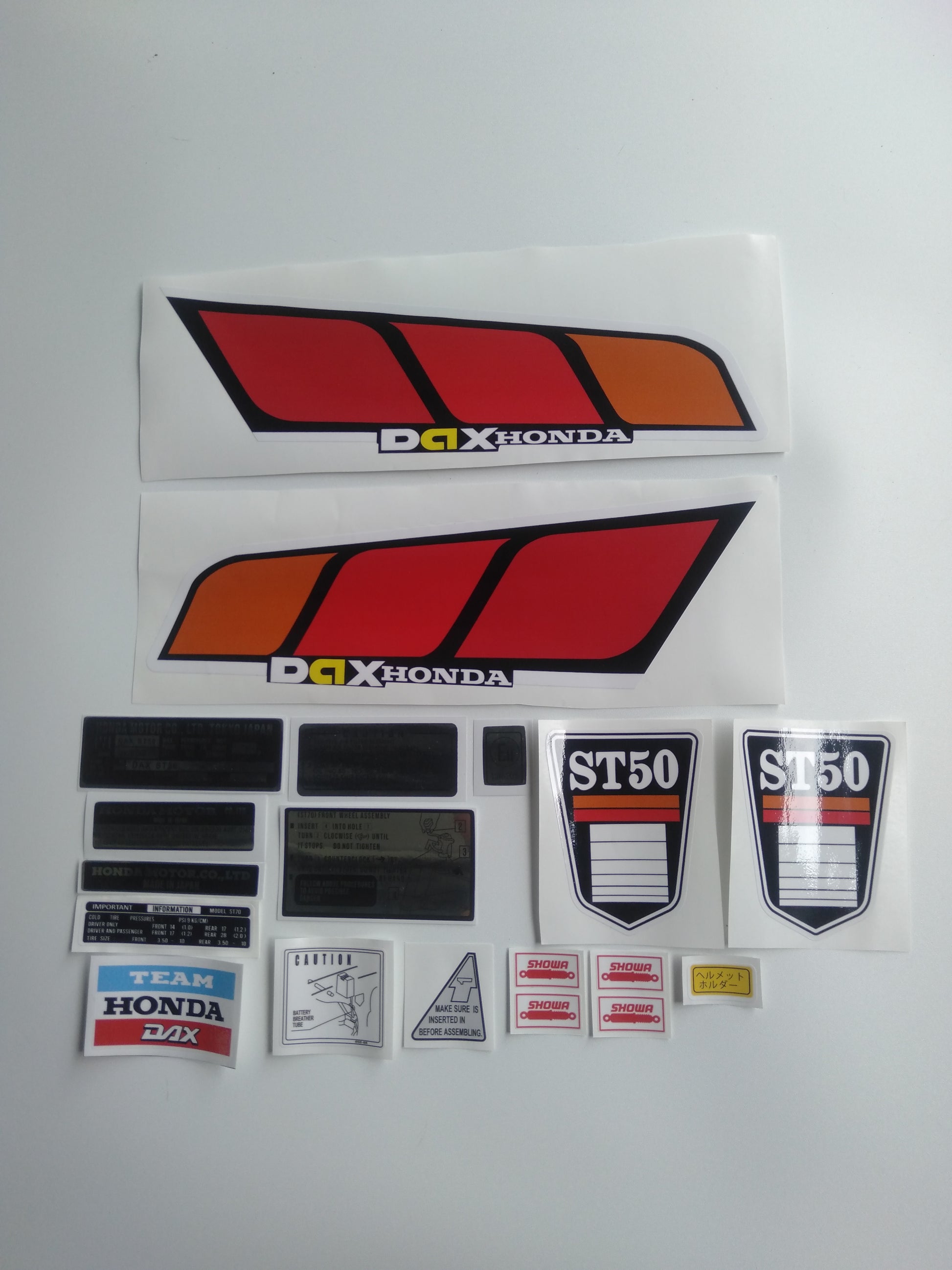 Collection of Dax Honda decals on a white background