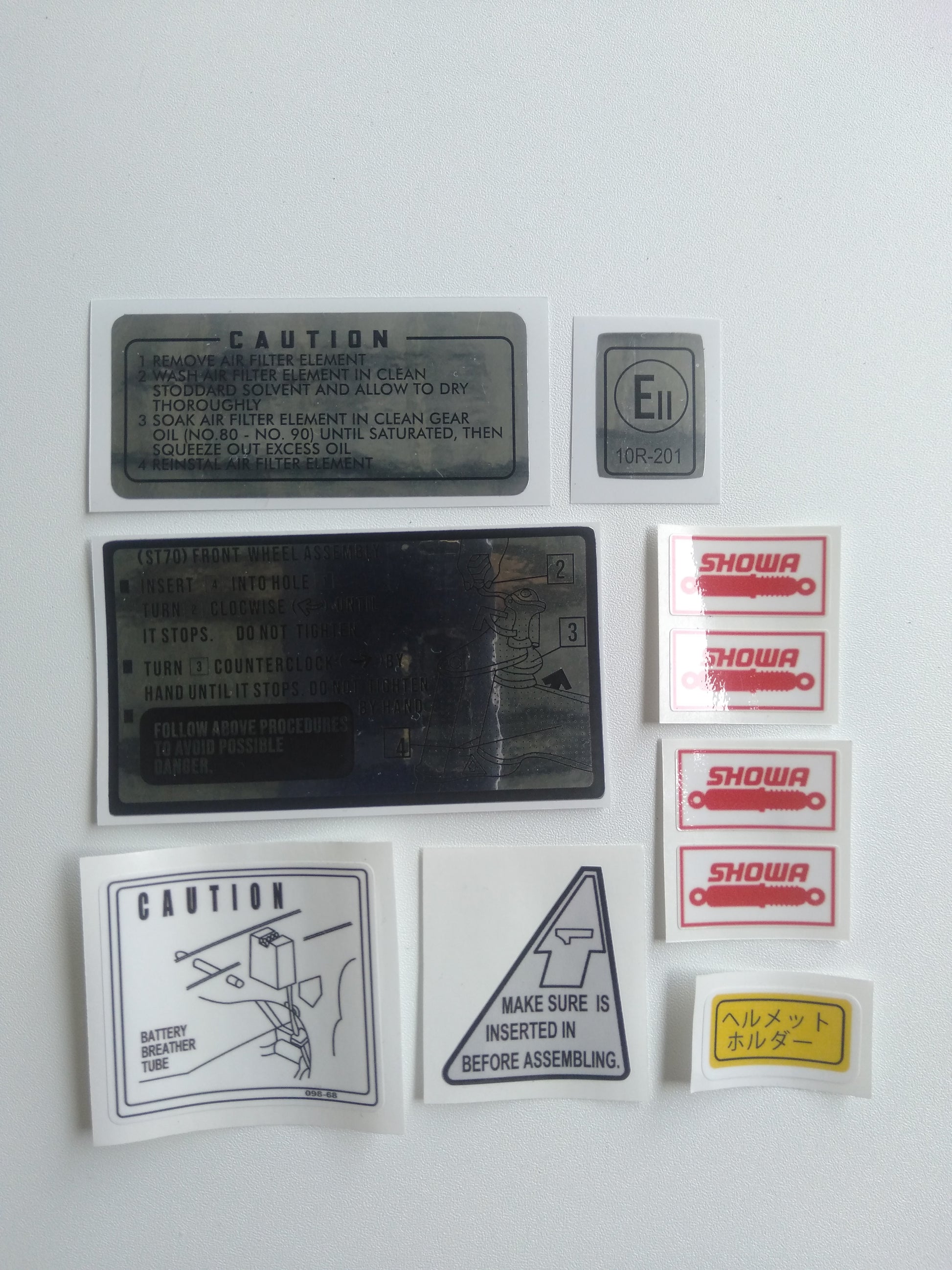 Collection of Honda DAX ST 50 various labels and stickers on a white background 