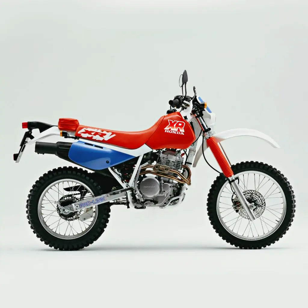 Red and blue dirt bike Honda XR 200 1987 on a light gray background
