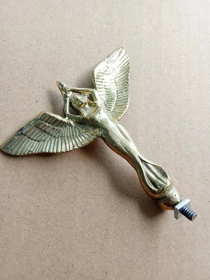 Vintage bicycle brass mudguard badge with ANGEL holding torch design