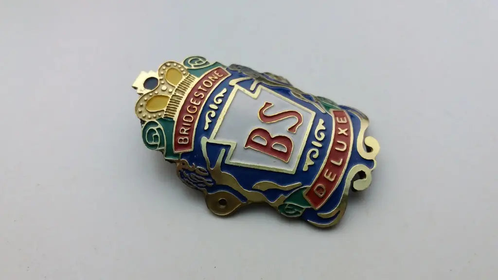 Bridgestone Deluxe multicolor bicycle emblem gold blue white red green yellow
