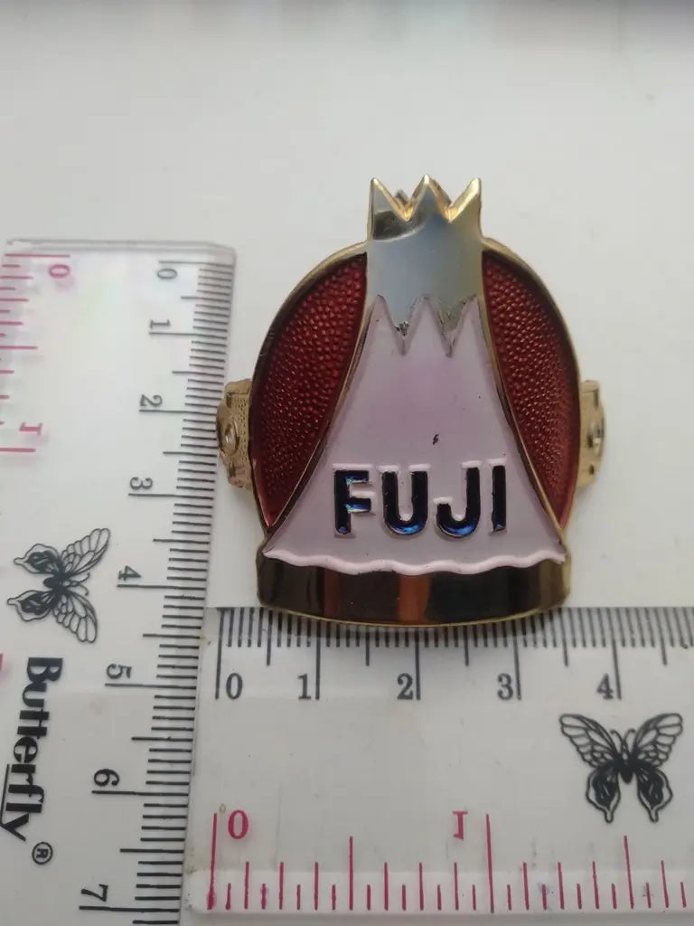 Classic FUJI Japan aluminum head badge installed on restored steel bicycle
