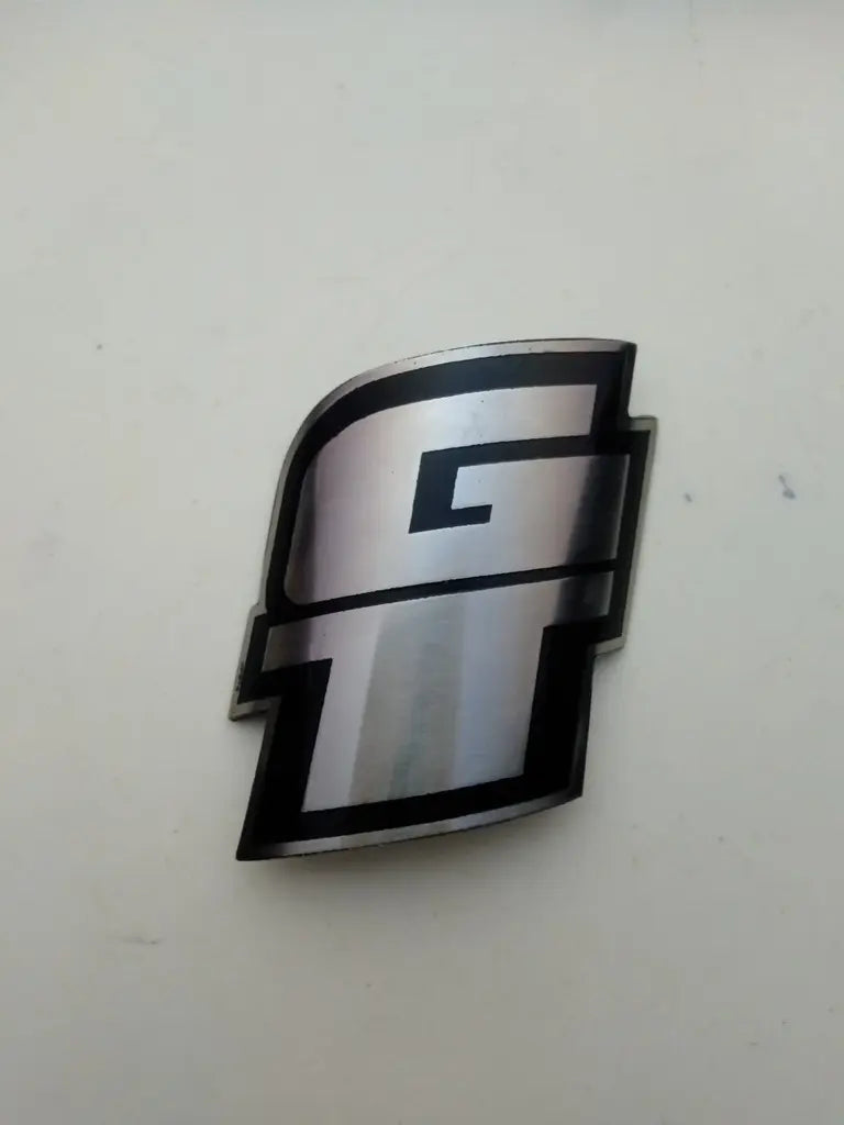 GT bicycle head badge emblem in etched handmade stainless steel reproduction.