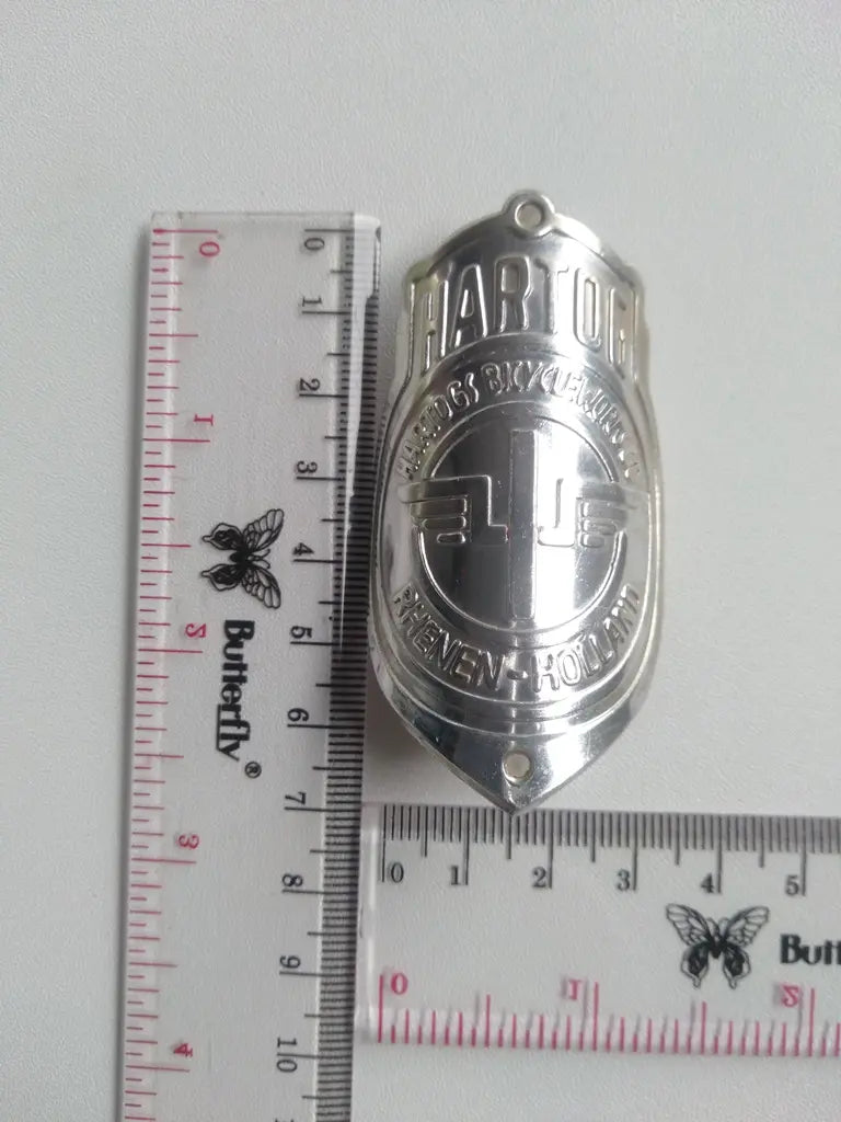 Classic HARTOG aluminum bicycle emblem for authentic vintage restoration