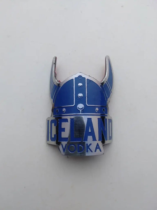 Iceland bicycle head badge emblem in etched handmade stainless steel with silver and blue Viking hat logo.