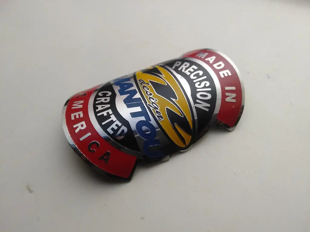 Manitou stainless steel bicycle head badge front view