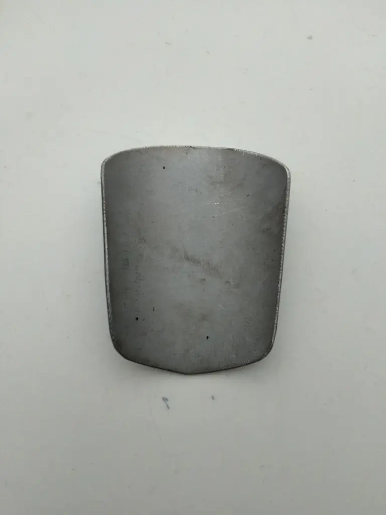 Rear view showing the clean bare metal surface on the back of the Marin bike badge.