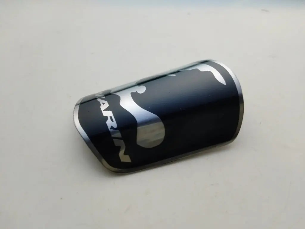 Marin black and silver stainless steel bicycle head badge packaged securely for global shipping.