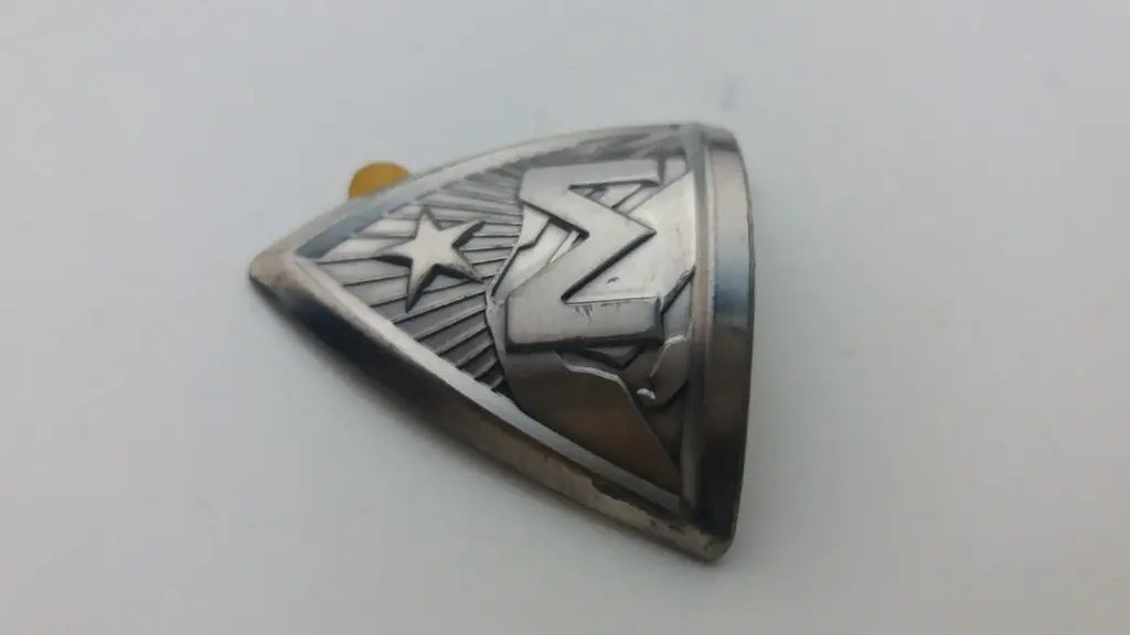 Close-up view of the detailed 3D embossed silver Marin M letter and star crest logo.