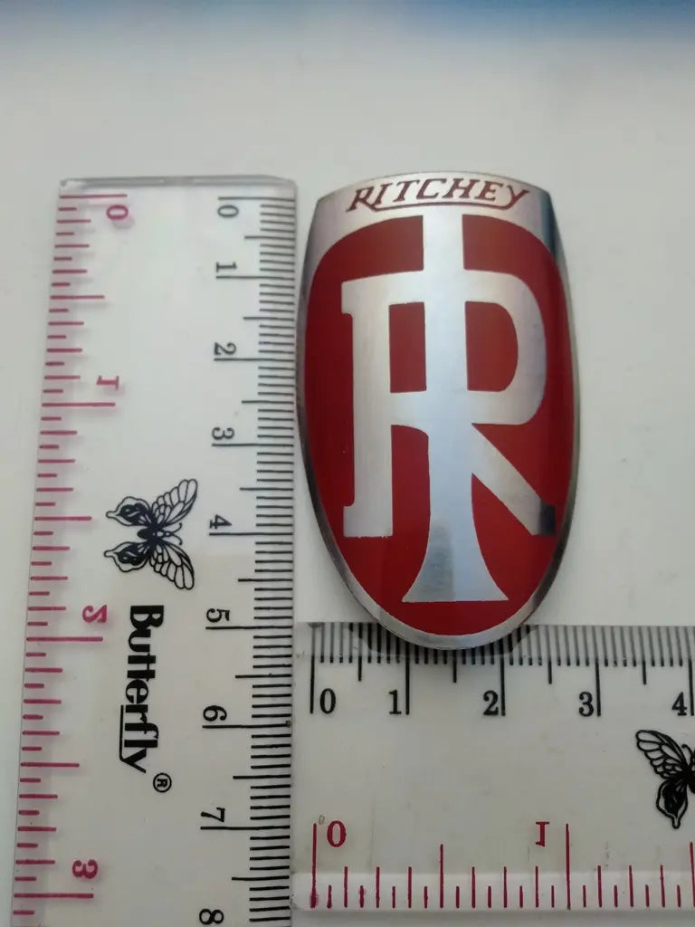 Measurement guide showing height and width dimensions of the handmade Ritchey stainless emblem.