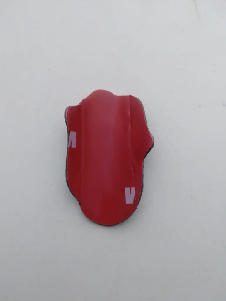Rear view showing the pre-applied double-sided adhesive tape on the Rolling Stone bike badge.