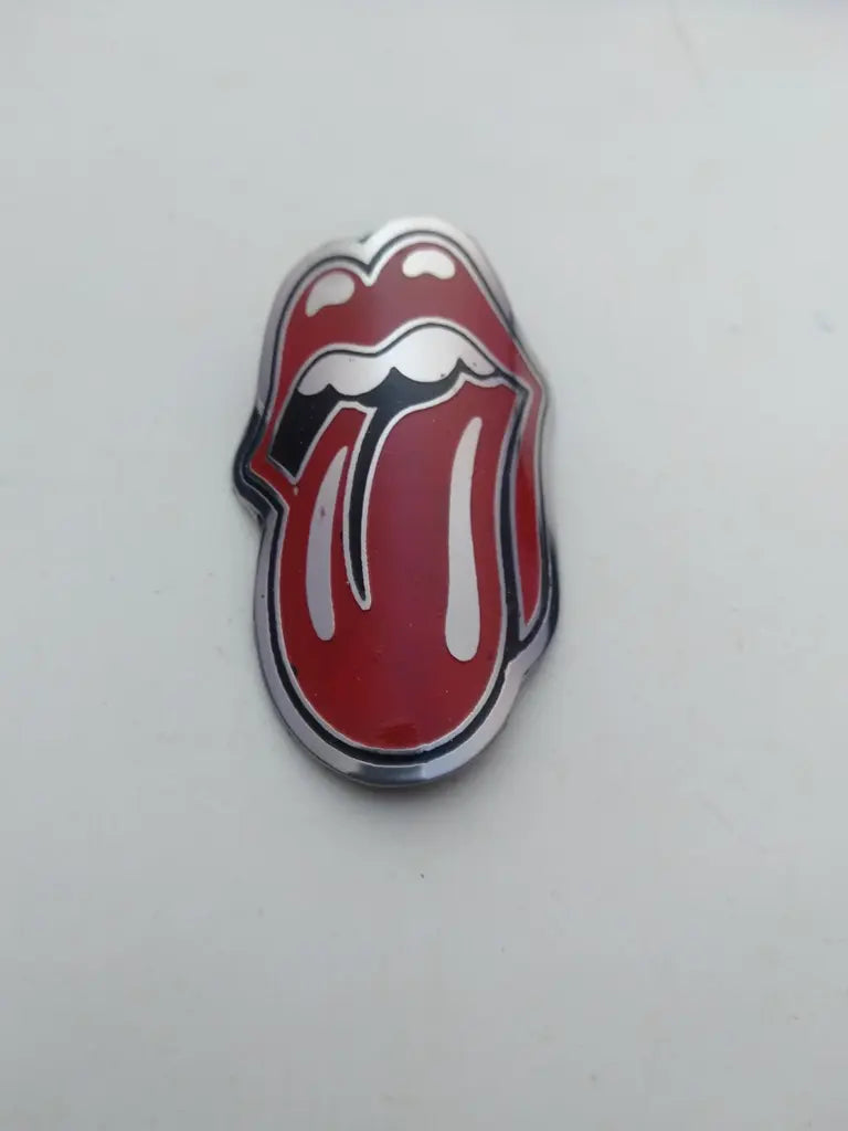 Rolling Stone bicycle head badge emblem in etched handmade stainless steel with silver and red tongue logo.