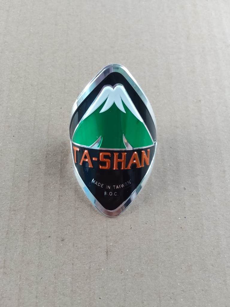 Ta-Shan logo on a textured surface